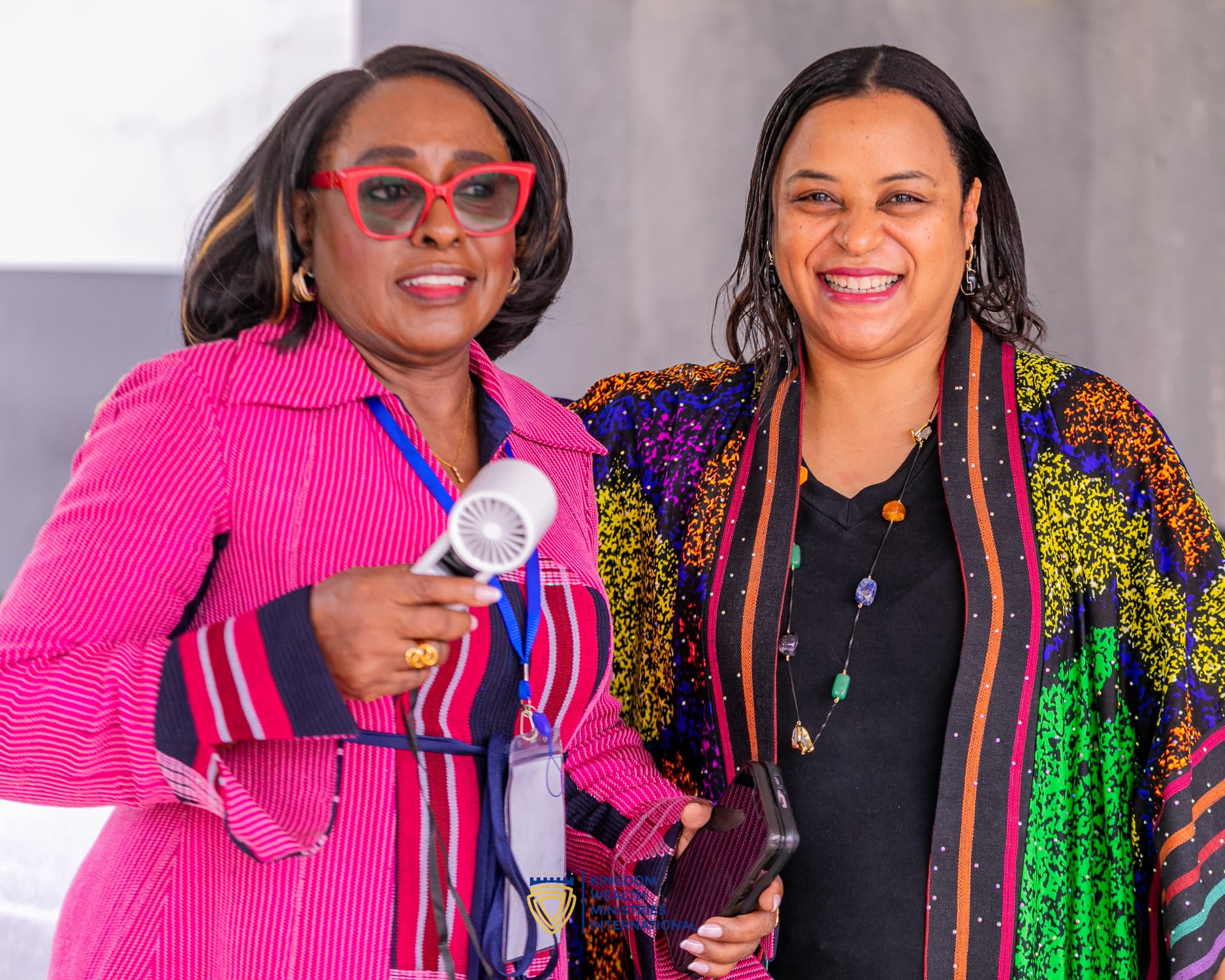 Two KWMI leaders smiling together at a ministry gathering